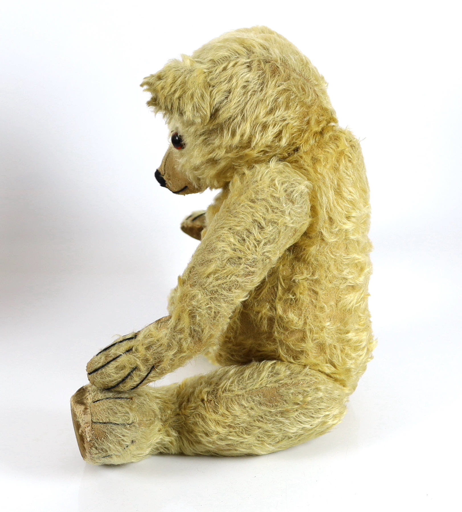 A large 1930's Chiltern bear, 53cm, with replaced nose stitching, some hair loss generally